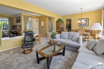 From the living room looking back to front entry and formal dining area.
