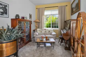 Extra sitting area off the front entry and living room views out to the front yard.