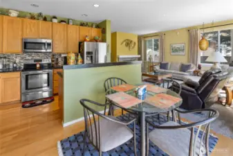 Kitchen and separate eating area looking back into the family room.