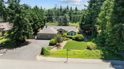 Front view of home and notice the side yard very private with mature landscaping.