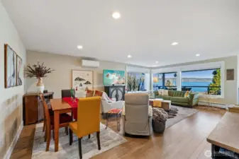 The great room accommodates your friends, family and neighbors easily. Easy care wide plank flooring allows for rearranging furniture any way you want...around the view...around the fireplace...