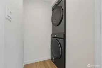 Equipped with Samsung high-efficiency washer and dryer for modern convenience and energy savings.