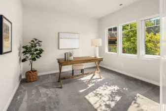 As you step inside the home the first room on your right is a large office with light-filled windows. Enclosed by double doors, it's the perfect WFH space.