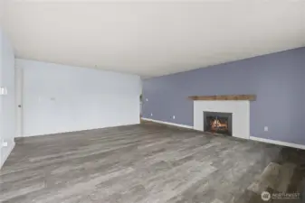 Front living room w/ wood burning fireplace