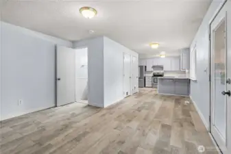 Dinning room or bonus space looking at half bath into the kitchen