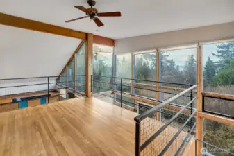 Upper open loft sitting space.