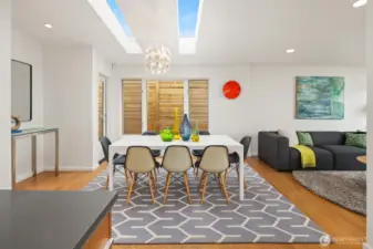Dual skylights lend visual interest and natural light to the dining area just off the kitchen.