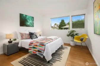 One of two additional main-floor bedrooms, both very gracious in scale with large closets and north-facing windows.