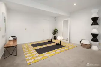 Consider a pull-out bed and a sliding door/wall system to allow this space to easily flex from exercise or office to guest accommodations.