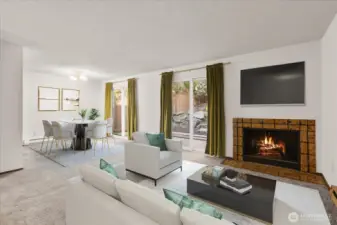 Large Living/Dining with wood burning fireplace. Virtually Staged