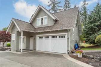 Carriage house. The main level is a double garage. Door on the left goes upstairs to the studio apartment.