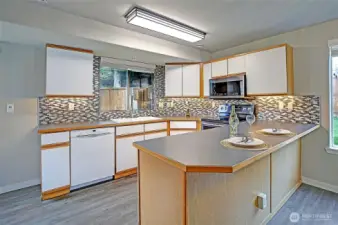 The kitchen features high end appliances including this Bosch Dishwasher. All the cabinets are ready to load your kitchen goodies and have been cleaned professionally.