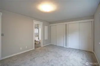 The Primary Bedroom has 2 large closets that connect behind the sliding doors.  Beautiful new paint job and carpet.