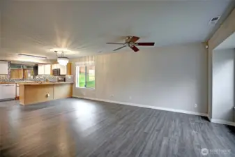 Generous main living room with nice ambient light.  Enjoy the ceiling fan to cool you on those hot summer days.