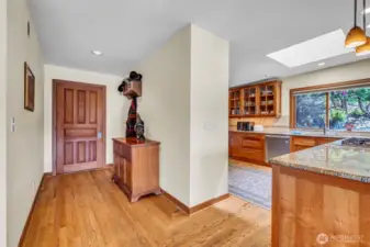Formal entry hallway, wood flooring, opens to magnificent great room with stunning 180 degree water views.
