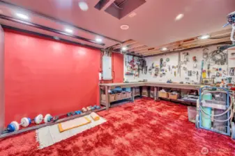 French door access to hobby/workout room/shop with built-in work bench. Utility room is through the hobby room, comes with stack Washer and Dryer, 85 gal water heater. Mechanical room has Lenix furnace and heat pump.