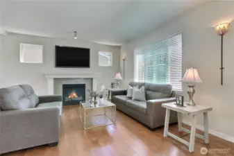 Step inside to a modern, freshly painted interior where the living room feels both inviting and incredibly comfortable. Natural light fills the space, highlighting the clean lines and warm tones. It’s the perfect spot to relax, entertain guests, or enjoy a quiet evening at home. This is comfort and style, thoughtfully combined.