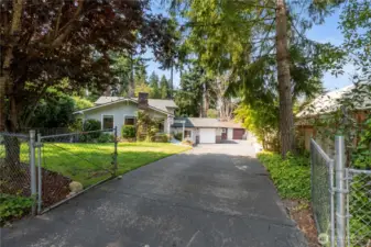 Nestled on a peaceful cul de sac steps from Lake Tapps, this updated open concept home offers 2356 sq ft on a fully fenced and gated park like setting