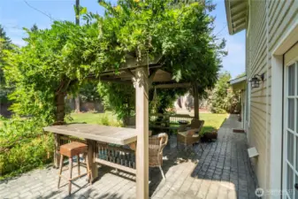 Cobblestone patio with pergula is a perfect place to relax