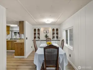 Dinging room with built in shelving and storage.