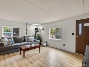 Spacious living room with access to rear deck.