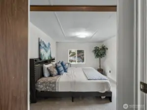 Large primary has plenty of room for a king bed.
