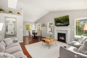 Cathedral ceilings, gorgeous hardwood floors and expansive windows fill this space with amazing light