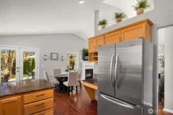 Gorgeous chef's kitchen with plenty of cabinet space, granite countertops and a beautiful eating bar that opens to the dining and living rooms