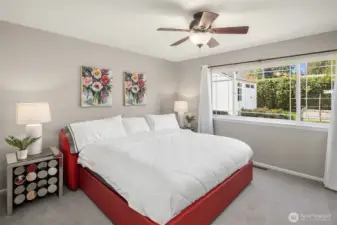 Spacious primary bedroom with large en-suite bathroom