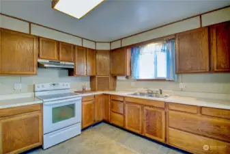 The kitchen is bright and charming.