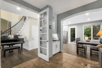 View from family room into the entry and kitchen