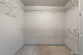 Spacious walk-in closet within the primary bedroom.