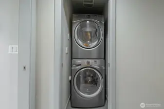 Washer/dryer within the primary bedroom.