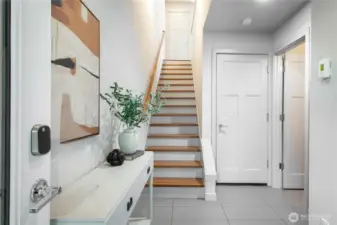 Step into this home through an inviting entryway with space for shoes and convenient storage.