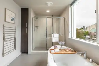Ensuite bathroom also features large standing shower and extra storage.