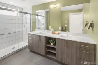 Spacious primary bathroom w private lavatory.