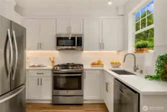 New cabinets, quartz countertops, undercabinet lighting and new sink (D/W & Microwave too).