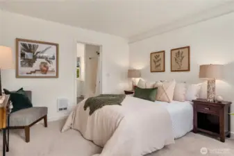 Large primary bedroom with new flooring and paint.