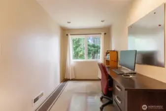 Tucked away on the upper level, this versatile space works beautifully as a home office or imagine a comfy chair, soft lighting, and baskets for your favorite books. Whether you’re reading, journaling, or simply enjoying a moment of stillness, this cozy retreat offers a peaceful spot to unwind and recharge.