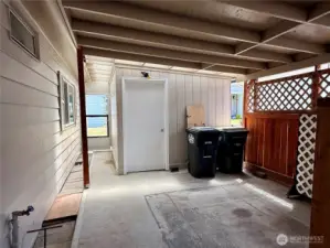 More of the carport with a view of the storage building.