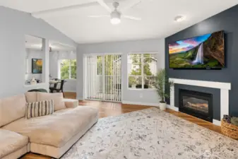 Spacious Livingroom with gas fireplace and abundant natural light