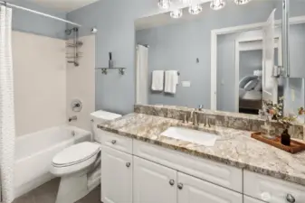 Tastefully remodeled bathroom with granite countertops