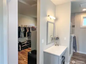 Primary ensuite bathroom with large walk-in closet.