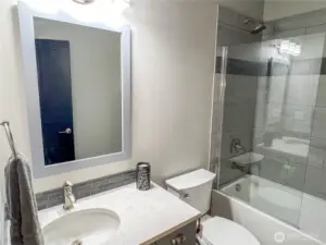 Second bathroom with bathtub.