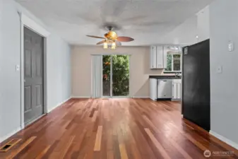 Large dining room is ready for entertaining with beautiful engineered hardwood floors!