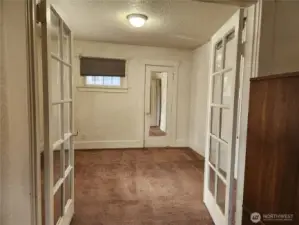 Bedroom 1, potential office, with french doors from living room