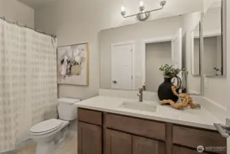 Full hall bath that features a large linen closet for extra storage.