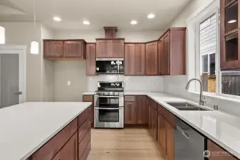 Quartz counters and double ovens are standard features