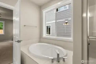 Large soaking tub with tile deck