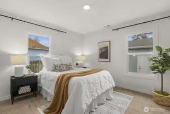 Second bedroom with backyard views